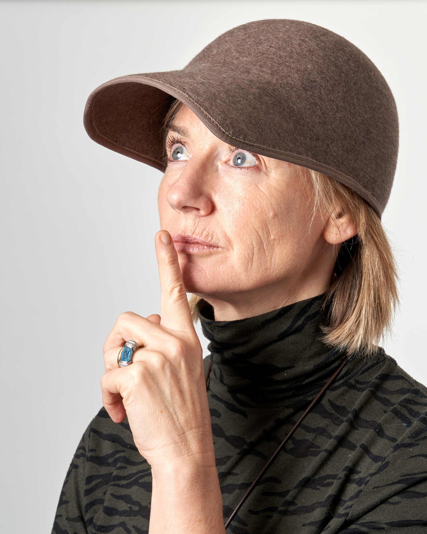 Tara O'Callaghan wearing a brown cap with a neutral background